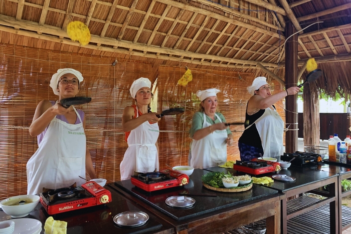 Participate in the preparation of bánh xèo during a cooking class in Da Nang