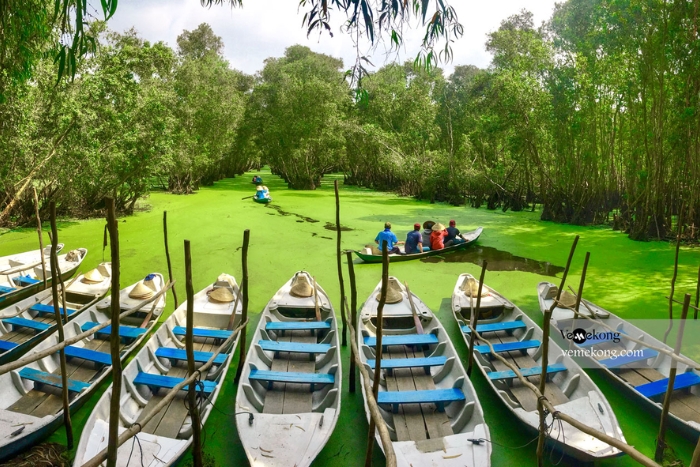 A traditional boat ride along the lush narrow canals