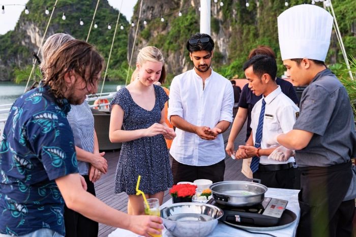 Cooking together at sunset on Halong Bay