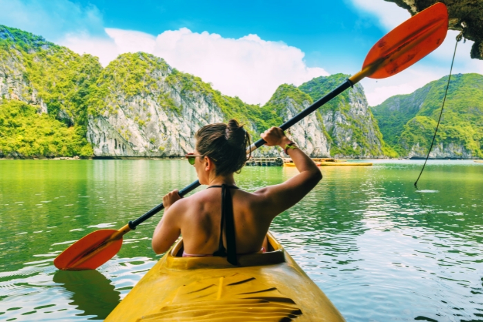 Kayaking freely through emerald waters of Halong Bay