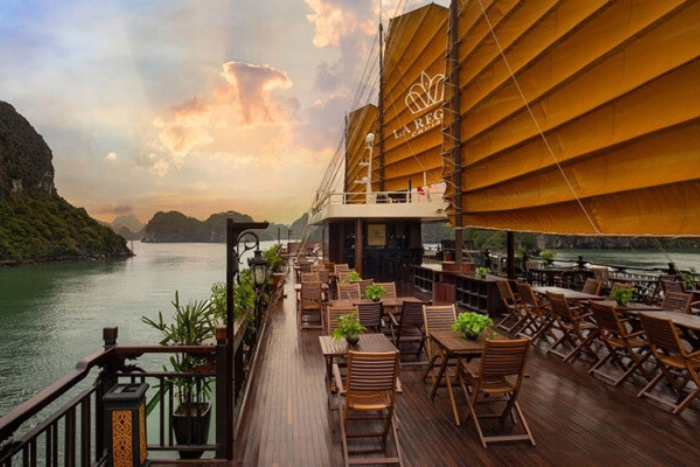 You can eat on the deck while admiring the picturesque scenery of Halong Bay