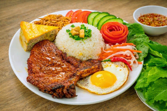 Stop for a cơm tấm, one of the best specialties in Saigon