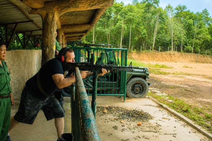 Trying the shooting range at Ben Dinh during a trip to Ho Chi Minh City
