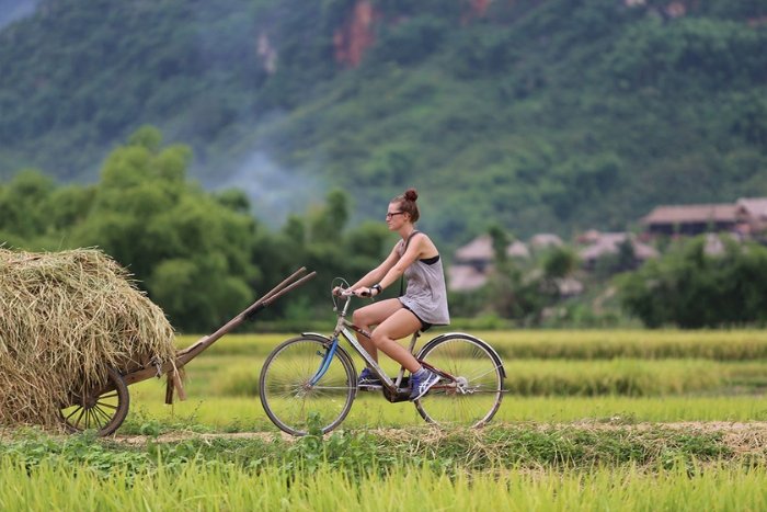 Pack comfortable clothes and sun protection for cycling in Mai Chau and Pu Luong