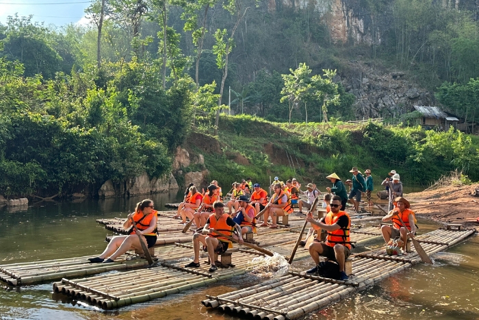 Try bamboo river rafting, what to do in Mai Hich? 