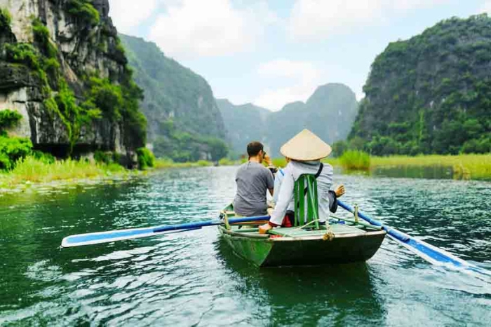 Peaceful boat ride on the tranquil waters of Tam Coc