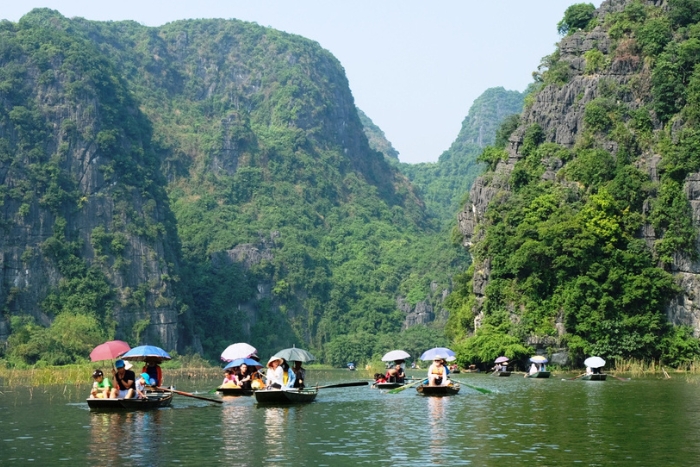 A peaceful boat trip exploring caves and mountains