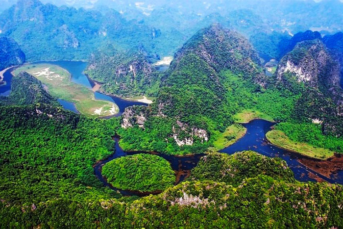 The spectacular view of Trang An with its many mountains covered in greenery