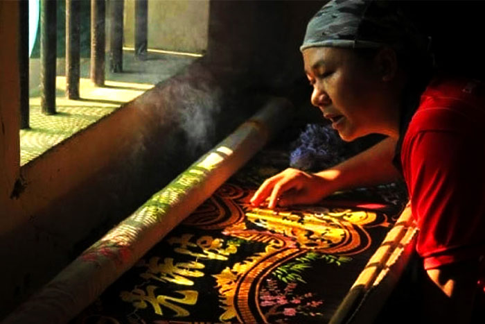 Visit Van Lam and learn about its traditional embroidery techniques