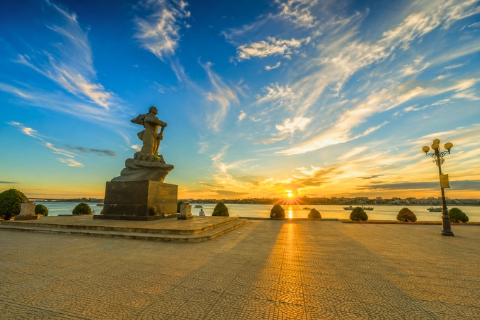 A peaceful moment by the Nhat Le River near the Mother Suot Monument