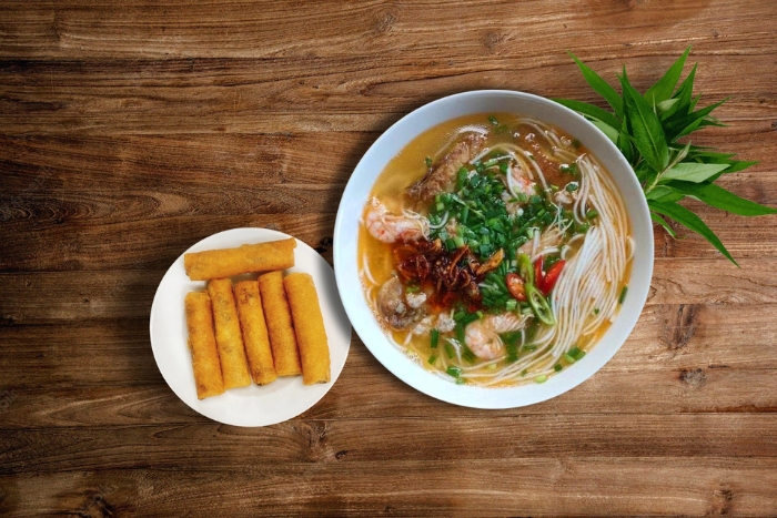 Warm local flavors: cháo canh Quang Binh served with crispy rolls