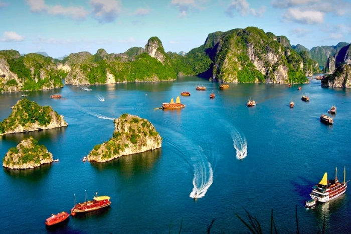 Majestic Halong Bay dotted with boats and limestone cliffs