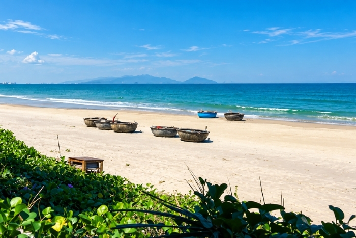 Moment of serenity on An Bang Beach during your 15-day Vietnam tour