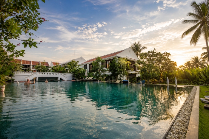 Relaxing by the pool at Legacy Hoi An Resort