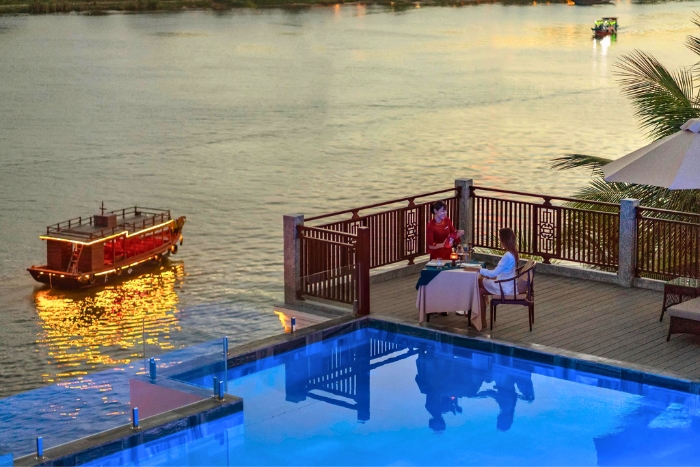 Rooftop swimming pool of a luxury hotel in Hoi An - a good choice for your high-end travel in Vietnam