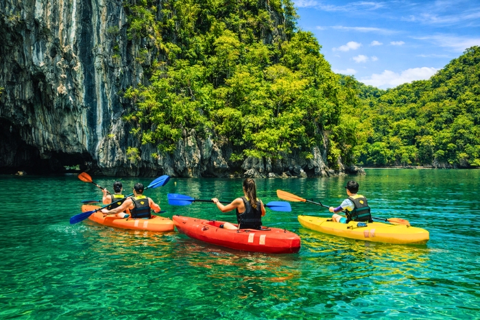 Exploring Halong Bay by kayak before snorkeling