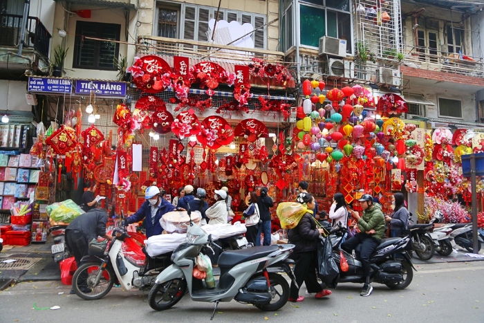 The streets in Hanoi are filled with people buying for Tet holiday in Vietnam