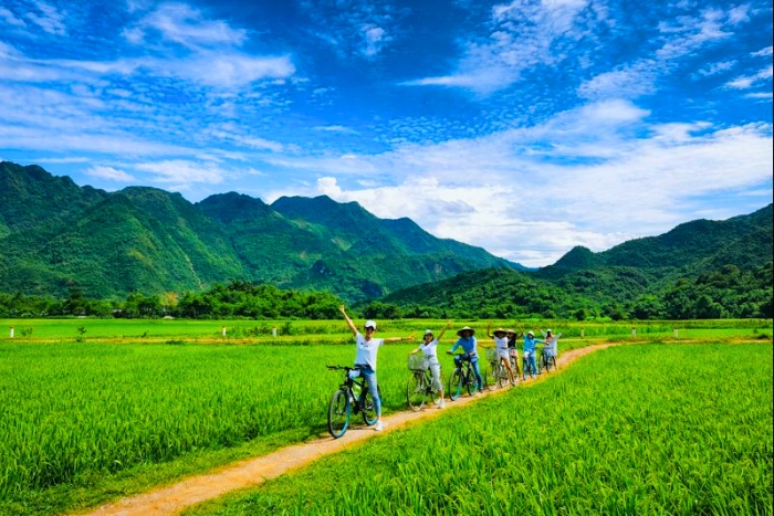 Cycling through rice fields and villages in Mai Chau during the Lunar New Year