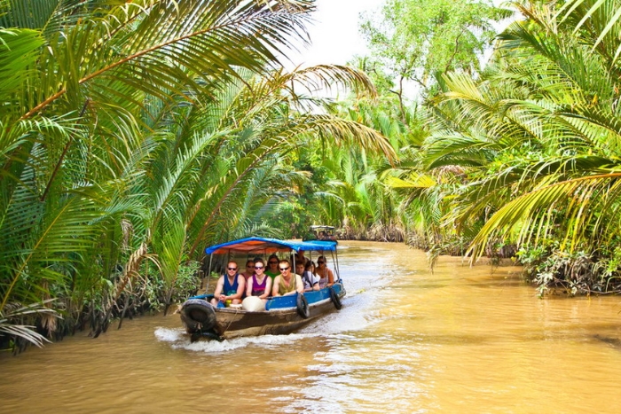 Private sampan ride along Ben Tre’s lush coconut-palm canals