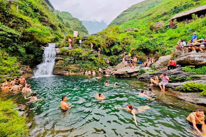 Trekking pauses at Du Gia waterfall for a swim