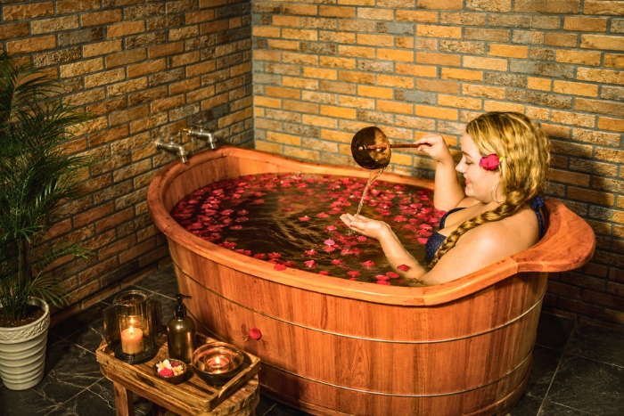 Enjoying a Red Dao herbal bath in Ta Van