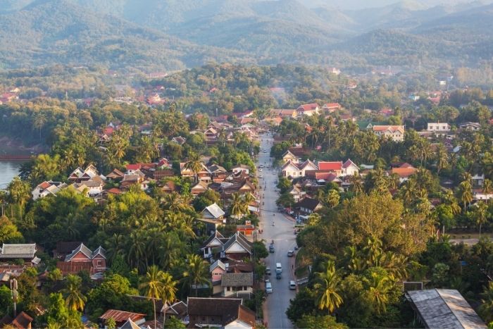 Travel to Laos in July, when tropical rains enhance the landscapes