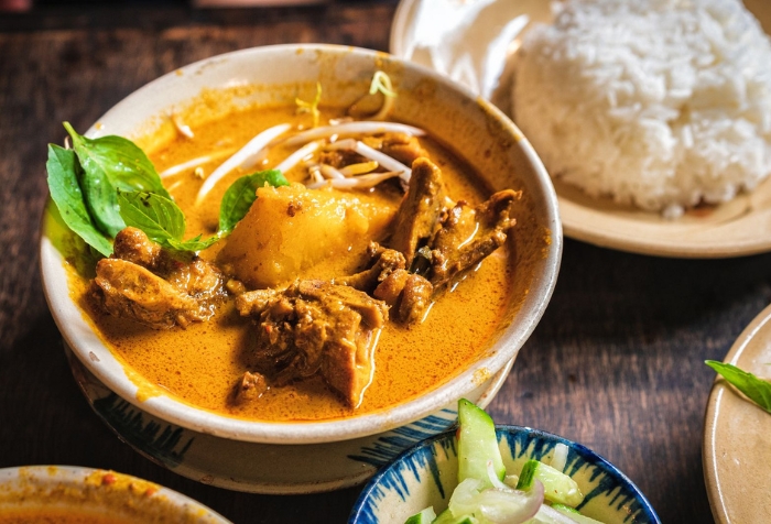 Curry can be served with white rice or baguette,...