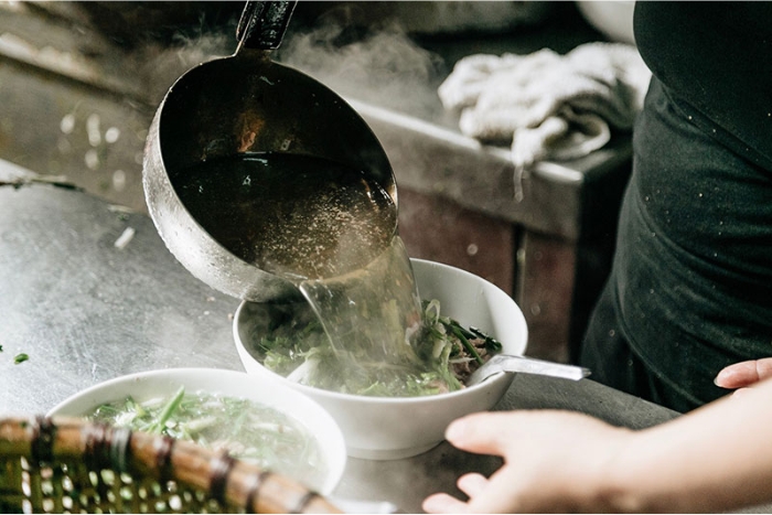 Preparing the broth for making Phở 