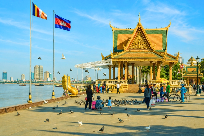 Take in the lively atmosphere of Phnom Penh from Sisowath Quay